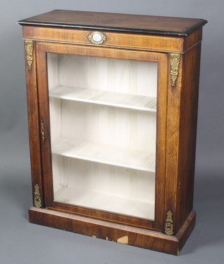 A Victorian walnut Pier cabinet with oval porcelain floral panel and gilt metal mounts, inlaid throughout, raised on a platform base 39"h x 30"w x 12"d 