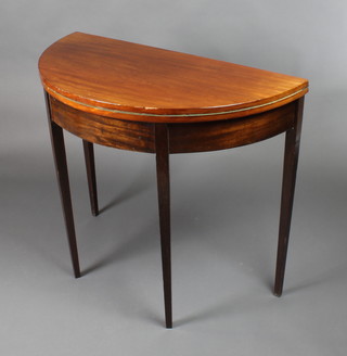 A Georgian style demi-lune card table, raised on square tapered supports 30"h x 36"w x 18"d 