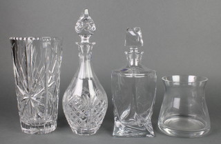 A Bohemian clear Art Glass decanter and stopper 11", a club shaped cut glass decanter and stopper 13", a waisted cut glass vase 9 1/2" and a circular glass vase 