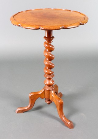 A Victorian turned mahogany wine table with pie crust edge, raised on spiral turned column and tripod support 28"h x 19" diam. 