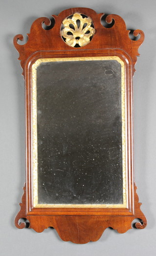 A rectangular plate Chippendale style mirror contained in a mahogany frame 38" x 16" 