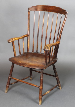 A 19th Century elm stick and bar back Windsor chair with turned stretcher 