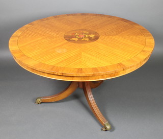 A 19th Century style inlaid satinwood snap top table, raised on pillar and tripod supports with quarter veneered top 31"h x 48" diam. 