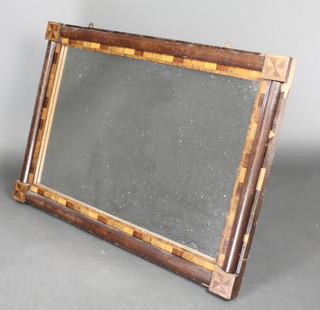 A Victorian rectangular plate over mantel mirror contained in an inlaid mahogany and specimen veneer frame 30"h x 42"w 
