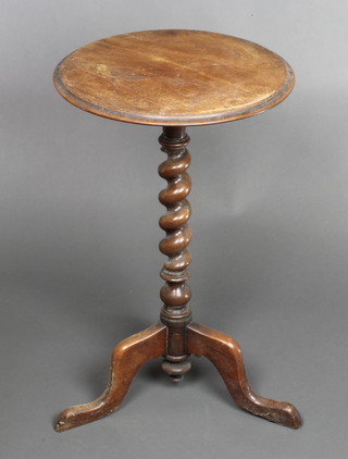 A Victorian circular walnut wine table, raised on a spiral turned column and tripod base 27"h x 16" diam. 