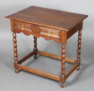 A Jacobean style oak side table fitted 1 long drawer with pear drop handles, raised on spiral turned supports, the base with box framed stretcher 28""h x 30"w x 19 1/2"d 