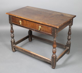 An 18th Century rectangular oak side table fitted a frieze drawer, raised on baluster turned columns  with box framed stretcher 28"h x 38 1/2"w x 22"d 