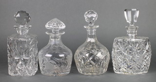 A cut glass spirit decanter and stopper 10", a mallet shaped decanter etched fuschias 8", a cut glass boat shaped decanter and stopper 10" and 1 other decanter and stopper 9 1/2" 