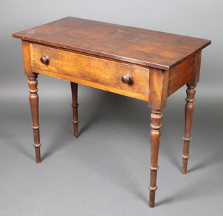 A Victorian mahogany rectangular side table fitted a drawer with tore handle, raised on turned supports 30"h x 34"w x 18"d 