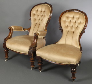 A Victorian mahogany show frame open arm chair upholstered in mustard coloured buttoned material, raised on turned supports together with a similar chair 