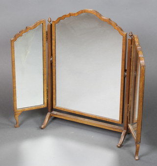 A Queen Anne style triple plate dressing table mirror contained in an arched framed 24" x 30"