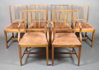 A set of 6 19th Century mahogany stick and rail back dining chairs with upholstered drop in seats, raised on square tapering supports with H framed stretcher 