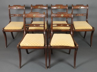 George Simpson, a set of 6 19th Century carved rosewood bar back chairs with shaped mid rails and woven cane seats, on sabre supports, with label marked George Simpson, Cabinet Maker and Undertaker 10 Southside, St Paul's Churchyard, London 