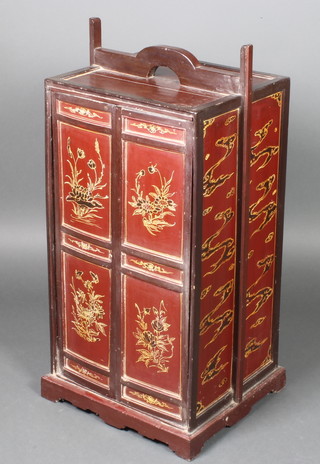 A 19th Century Chinese red lacquered cabinet enclosed by panelled doors 34"h x 16"w x 14"d 