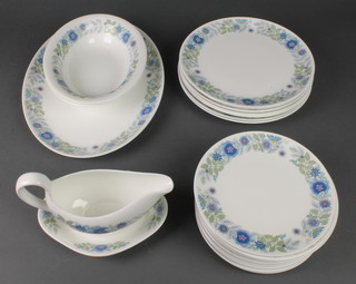 A 25 piece Wedgwood Clementine pattern dinner service comprising 12 side plates, 8 dinner plates, sauce boat and stand, 2 vegetable dishes and a meat plate  