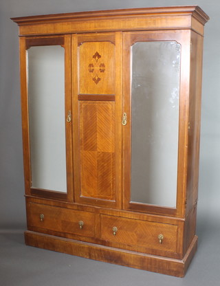 An Edwardian inlaid mahogany double wardrobe with moulded cornice, the centre section fitted an inlaid panel flanked by a pair of cupboards enclosed by arched plate mirrored doors, the base fitted 2 long drawers 79"h x 61"w x 22"d 