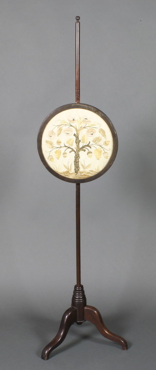 A Victorian pole screen with circular tapestry banner decorated a tree, (the banner at 40"h), raised on pillar and tripod supports 63"h 