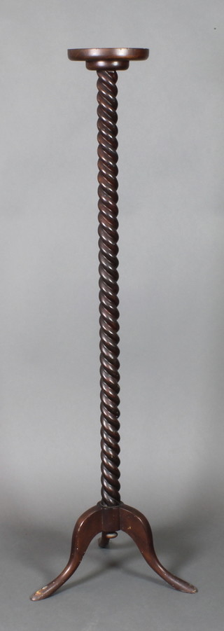 A Victorian spiral turned mahogany torchere raised on pillar and tripod supports 58"h x 8 1/2" diam. 