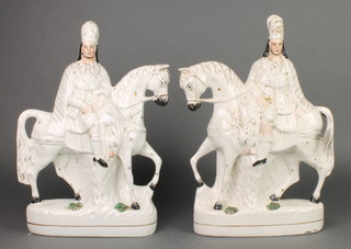A pair of Victorian Staffordshire figures of highlanders on horseback 15" 