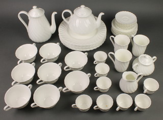 A matched Wedgwood tea and coffee set of plain fluted designed comprising 8 coffee cups, 8 saucers, 8 two handled cups, 8 saucers, 3 mugs, teapot, coffee pot, milk jug, sugar bowl, a salt pot and cover, 10 dinner plates 