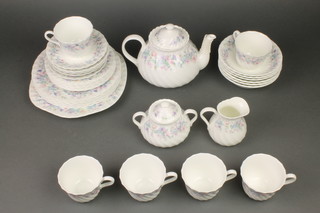 A Wedgwood Angela pattern tea set comprising 6 tea cups, 6 saucers, teapot, milk jug, sugar bowl and lid, 6 small plates, 6 medium plates, sandwich plates and 6 dessert bowls  