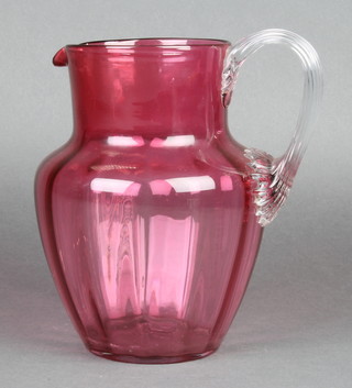A Victorian cranberry jug with fluted handle