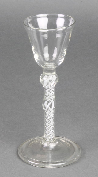 A Georgian cordial with double bubble stem with white ribbon twist decoration and wide foot 9" 