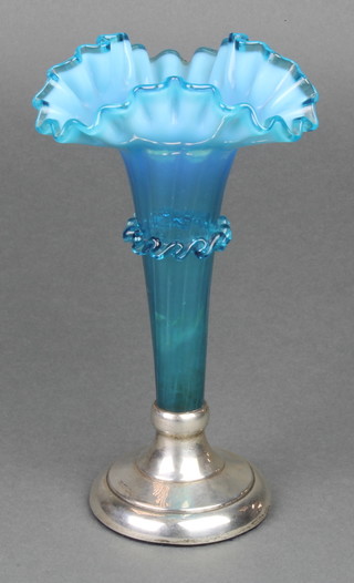 A Victorian turquoise vaseline glass tapered vase now with silver base 8" 