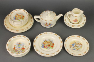 A quantity of Royal Doulton Bunnykins comprising teapot and lid, milk jug, 4 salad bowls, 4 dinner plates, 5 side plates, 2 small plates, 9 saucers and a babies bowl