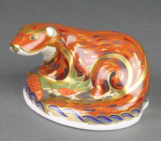 A Royal Crown Derby Japan pattern paperweight in the form of a reclining otter with gold plug 4 1/2" 