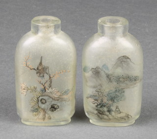 A pair of Chinese flattened scent bottles, the interior decorated with mountainous views and figures 2 1/2" 