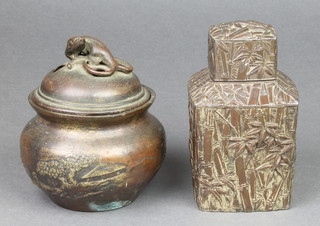 An antimony tea caddy with interior lid and cover, decorated with bamboo 4 1/2", a Chinese bronze baluster vase with landscape view and later lid 5" 