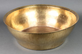 A circular brass bowl 6"h x 19" diam. 