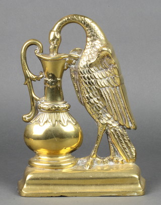 A Victorian brass door stop in the form of bird drinking from a ewer 10"h x 7 1/2" 
