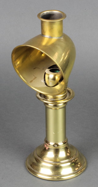 A 19th/20th Century brass candlestick with deflector 13"
