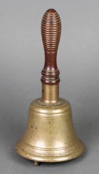 A Victorian brass hand bell with turned wooden handle