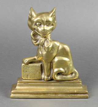 A Victorian brass door stop in the form of a seated "Ye Cheshire Cat" 10" 