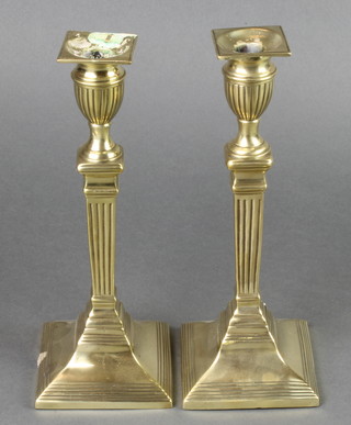 A pair of 19th Century reeded brass Adam style candlesticks with detachable sconces 10" 