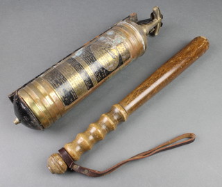 A turned wooden truncheon together with a Pyrene fire extinguisher 