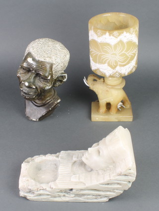 An "Egyptian" carved marble keystone/scroll decorated a bust of a pharaoh, a carved African hardstone bust 10" and a carved hardstone table lamp 11" 
