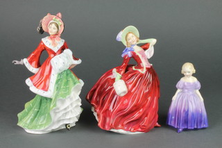 A Royal Doulton figure - Marie HN1770 5", a ditto Autumn Breezes HN1934 8" and another Winter Time HN3622 9" 
