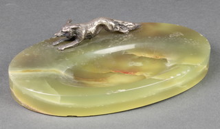 An Art Deco onyx ashtray decorated a silver plated running fox 8", slight chips to rim