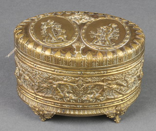 An oval Continental embossed gilt metal trinket box, the lid decorated figures an archer, raised on 4 panelled supports 3" x 5" x 3 1/2" 