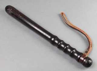 A turned wooden Police truncheon marked O86D179 14", some bruises