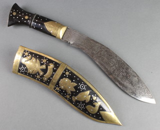 A presentation Kukri with 10" blade contained in a horn and brass mounted scabbard 