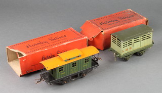 A Hornby Series O gauge RS687 Caboose together with a Hornby Series no.1 cattle truck 
