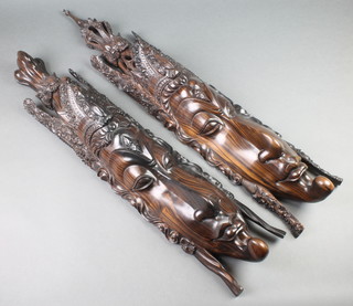 A pair of Indonesian carved rosewood masks 33 1/2" 