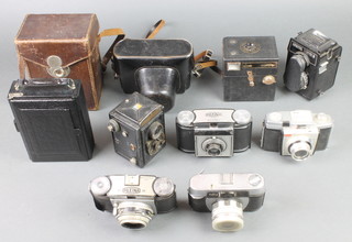 A Voigtlander, an Ibsor D.R.P folding camera, an Lubitel 168B camera, a Prinzflex 500 camera, a Halina Paulette camera, a Paxina 29 and 1 other,  a Kodak Colowsmap 35 box camera