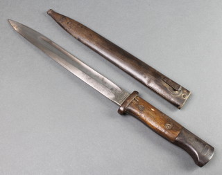 Gottlieb Hammesfahr, a German bayonet with 10" blade, complete with scabbard, the blade marked Gottlieb Hammesfahr Solingen Foche 