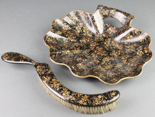 A papiermache scallop shaped crumb tray and brush 12"